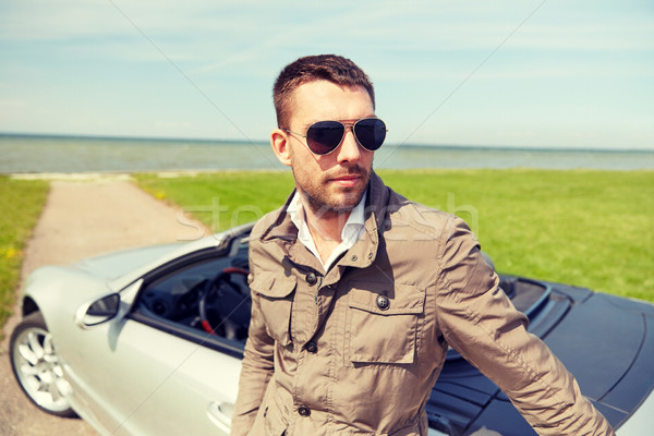 Stock photo: man near cabriolet car outdoors