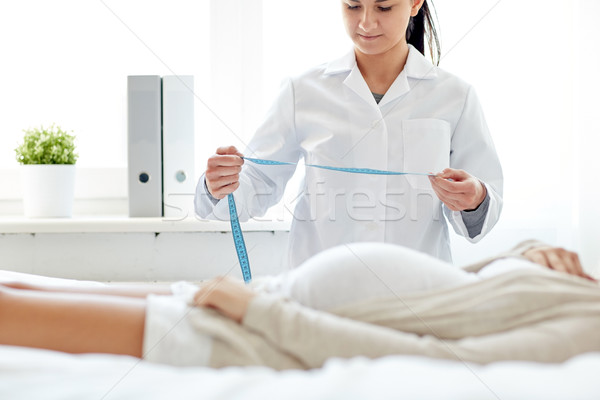 close up of doctor and pregnant woman at hospital Stock photo © dolgachov