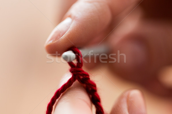 close up of hands knitting with crochet hook Stock photo © dolgachov