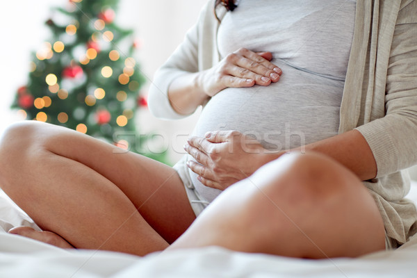Сток-фото: беременная · женщина · сидят · кровать · домой · беременности