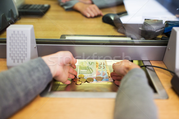 hands taking cash money at bank office Stock photo © dolgachov