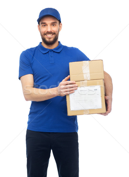 happy delivery man with parcel boxes Stock photo © dolgachov