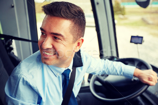 happy driver driving intercity bus Stock photo © dolgachov