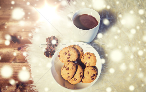 cups of hot chocolate with cookies on fur rug Stock photo © dolgachov