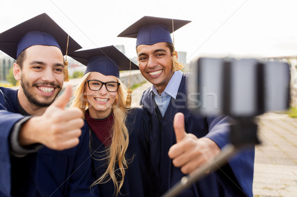 Stockfoto: Studenten · afgestudeerden · smartphone · onderwijs · afstuderen