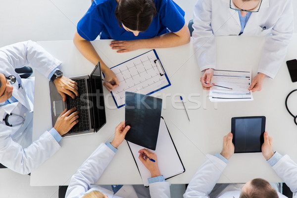 doctors with x-ray and cardiogram at hospital Stock photo © dolgachov