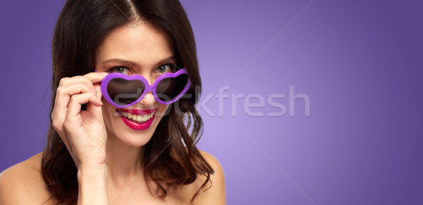 woman with ultra violet heart shaped shades Stock photo © dolgachov