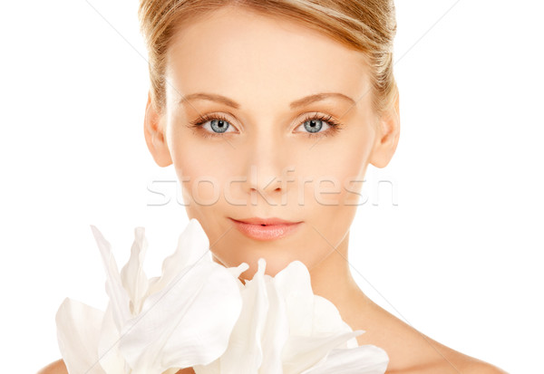 beautiful woman with madonna lily Stock photo © dolgachov