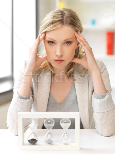 Stock photo: pensive businesswoman with sand glass