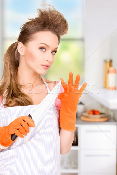 housewife with big knife Stock photo © dolgachov