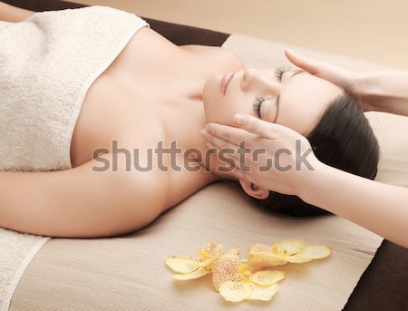 Stock photo: woman in spa salon lying on the massage desk