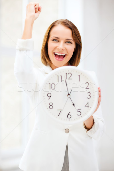 businesswoman with clock Stock photo © dolgachov