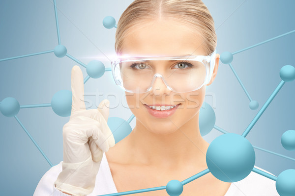 woman in protective glasses and gloves Stock photo © dolgachov