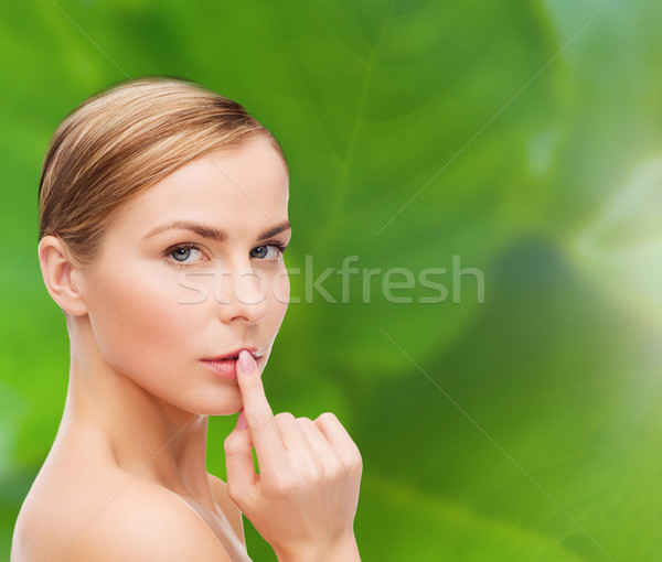 young woman doing hush gesrute Stock photo © dolgachov