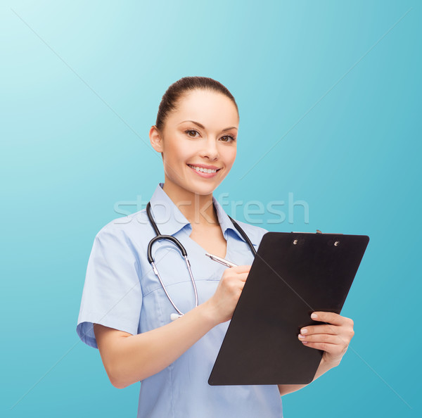 smiling female doctor or nurse with stethoscope Stock photo © dolgachov