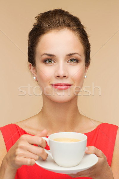 Mujer sonriente vestido rojo taza café ocio felicidad Foto stock © dolgachov