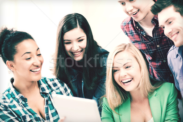 students looking at tablet pc in lecture at school Stock photo © dolgachov