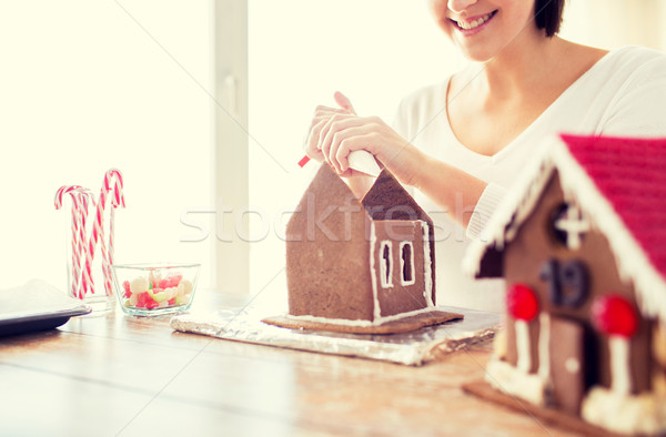 close up of woman making gingerbread houses Stock photo © dolgachov
