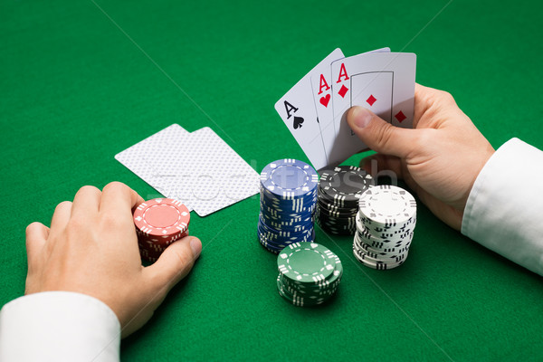 poker player with cards and chips at casino Stock photo © dolgachov