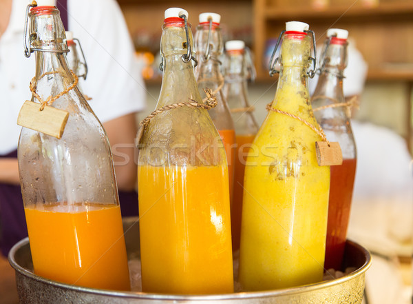 Bouteilles jus glace seau marché boissons [[stock_photo]] © dolgachov