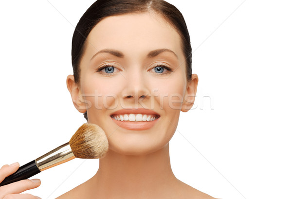 woman applying powder foundation with brush Stock photo © dolgachov