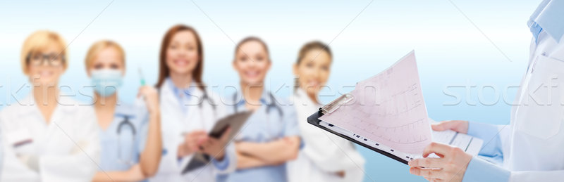Weiblichen Arzt halten Zwischenablage EKG Gesundheitswesen Stock foto © dolgachov