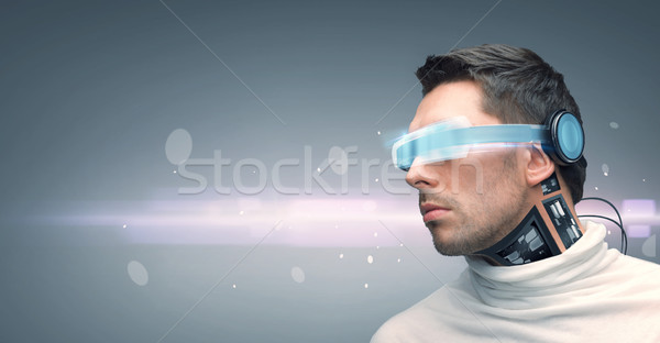 man with futuristic glasses and sensors Stock photo © dolgachov
