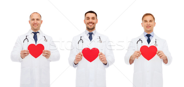 Foto stock: Tres · sonriendo · masculina · médicos · rojo · corazones