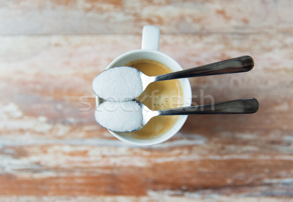 close up of white sugar on teaspoon and coffee cup Stock photo © dolgachov