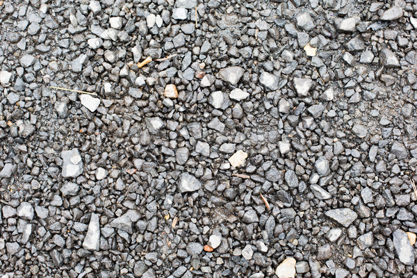 close up of gray macadam stones on ground Stock photo © dolgachov