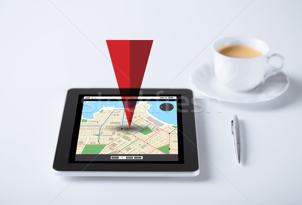 tablet pc with gps navigator map and cup of coffee Stock photo © dolgachov