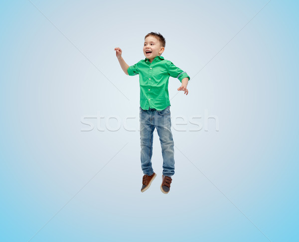 Feliz pequeno menino saltando ar felicidade Foto stock © dolgachov