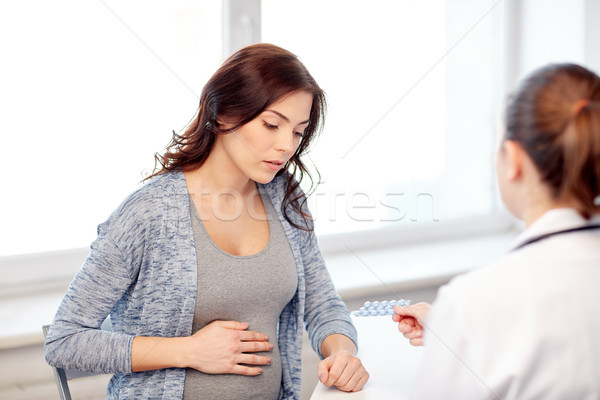 gynecologist doctor and pregnant woman at hospital Stock photo © dolgachov