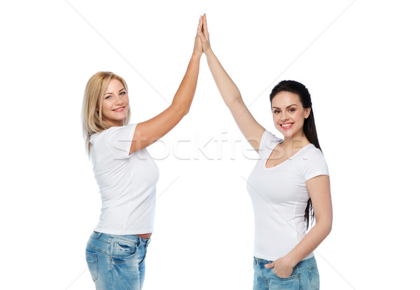 group of happy different women in white t-shirts Stock photo © dolgachov