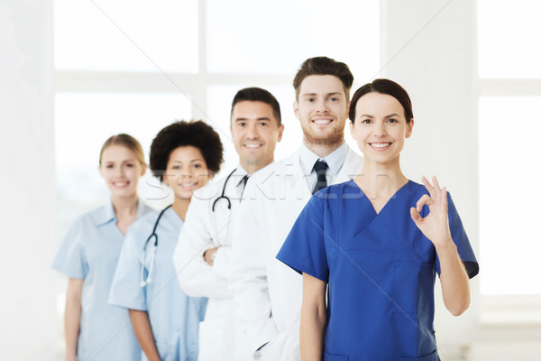 group of happy doctors at hospital Stock photo © dolgachov