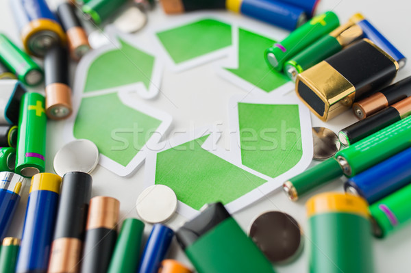 close up of batteries and green recycling symbol Stock photo © dolgachov