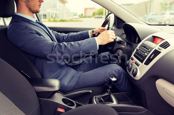 [[stock_photo]]: Jeune · homme · costume · conduite · voiture · transport
