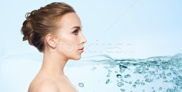 beautiful young woman face over white background Stock photo © dolgachov