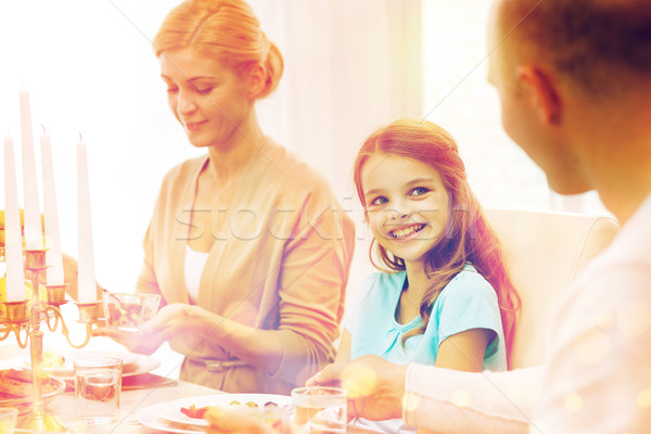 Stock photo: smiling family having holiday dinner at home