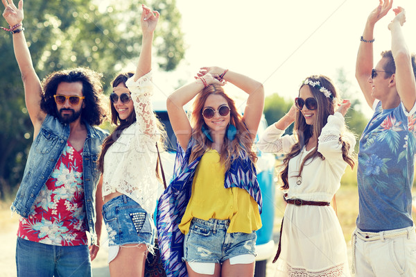 Stock photo: happy young hippie friends dancing outdoors