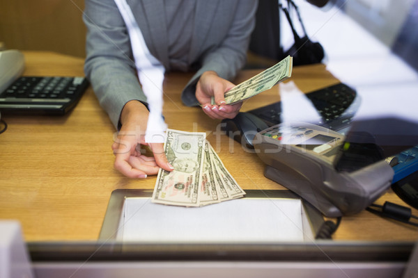 clerk giving cash money to customer at bank office Stock photo © dolgachov