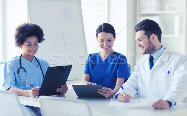 group of happy doctors meeting at hospital office Stock photo © dolgachov