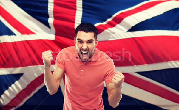 Stock photo: angry man showing fists over brittish flag