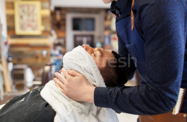 barber softening male face sking with hot towel Stock photo © dolgachov