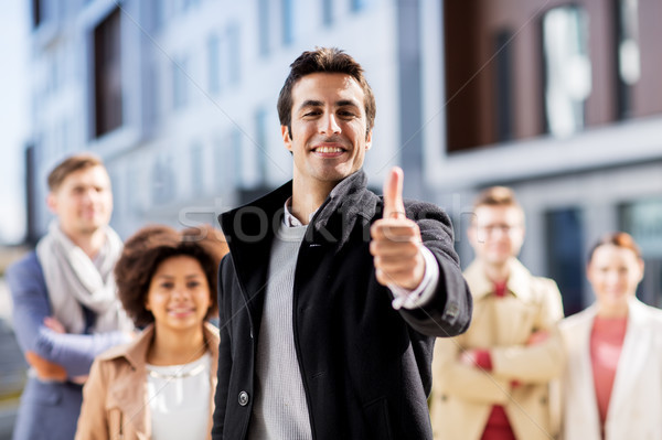 international business team showing thumbs up Stock photo © dolgachov