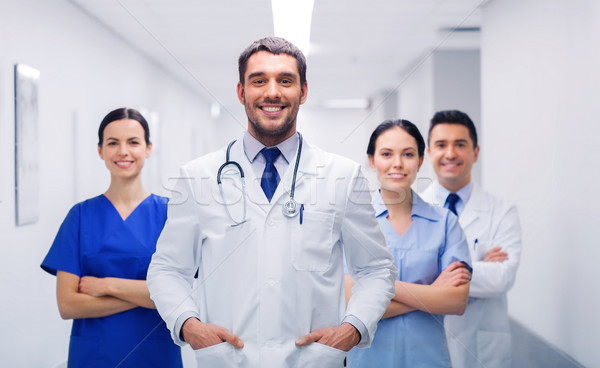 happy group of medics or doctors at hospital Stock photo © dolgachov