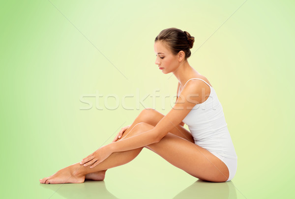 Stock photo: beautiful woman touching her smooth bare legs