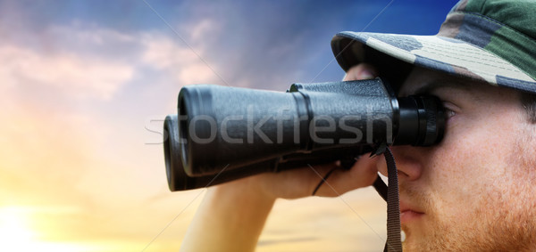 Stock photo: close up of soldier face looking to binocular