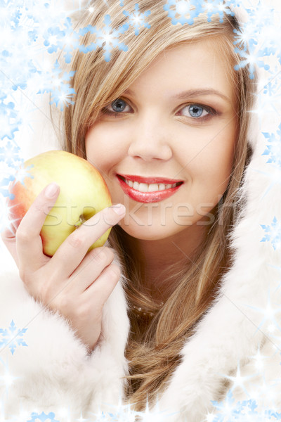 lovely blond in fur with apple Stock photo © dolgachov