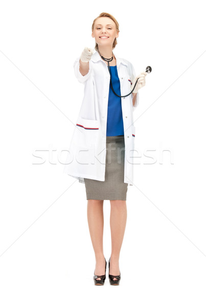 attractive female doctor pointing her finger Stock photo © dolgachov